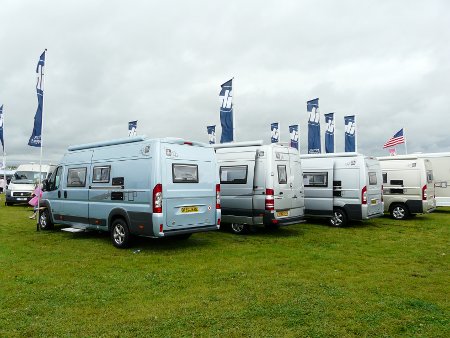 ...to IH's much larger and more expensive van conversions... (note the unusual custom rear door replacement)