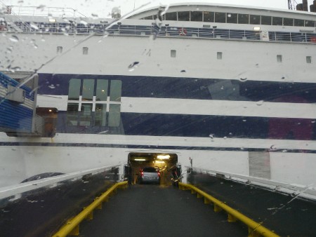 Boarding the ferry in Rotterdam - it's still raining (bigger motorhomes get a wider entrance than this!)