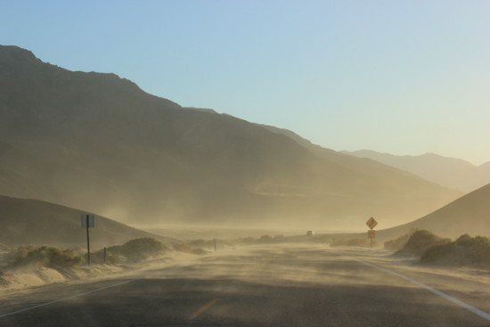 Sand blowing across the road Death Valley